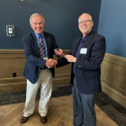 Ron Suppes receives gavel from Kent Juliot